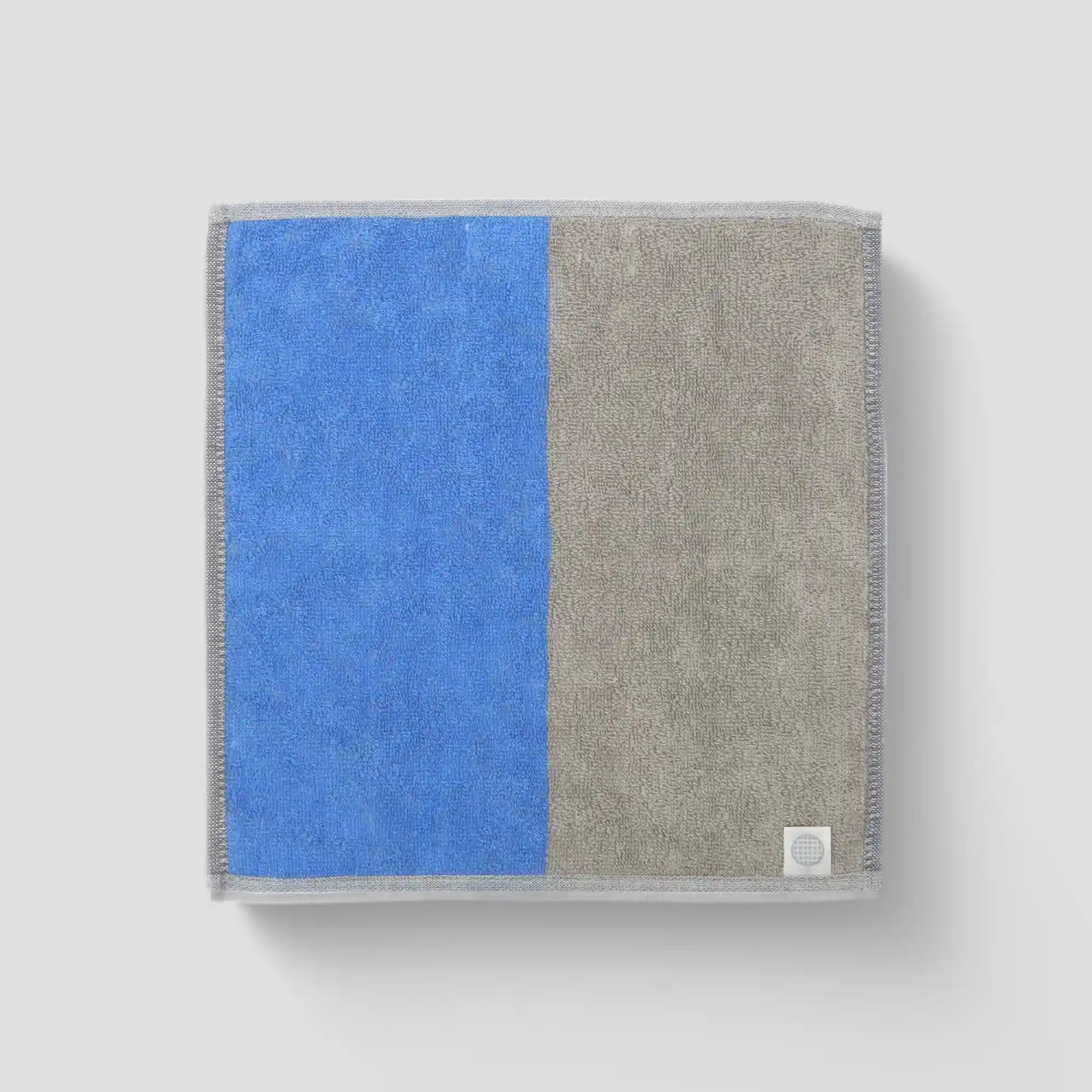 A collection of "tonari" Imabari towel in blue and gray backside with Iori&