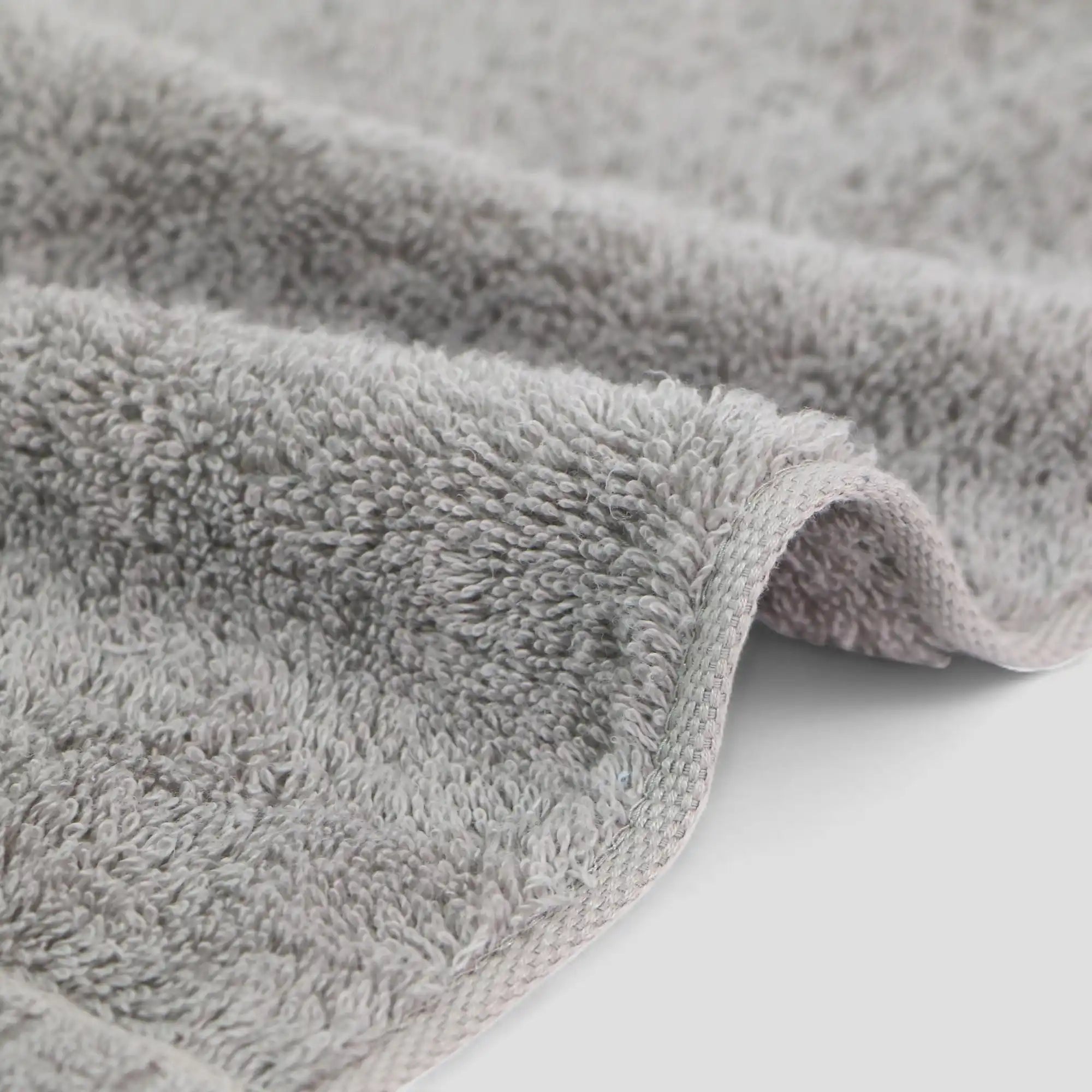 Close-up of a gray textured Imabari towel on a white background