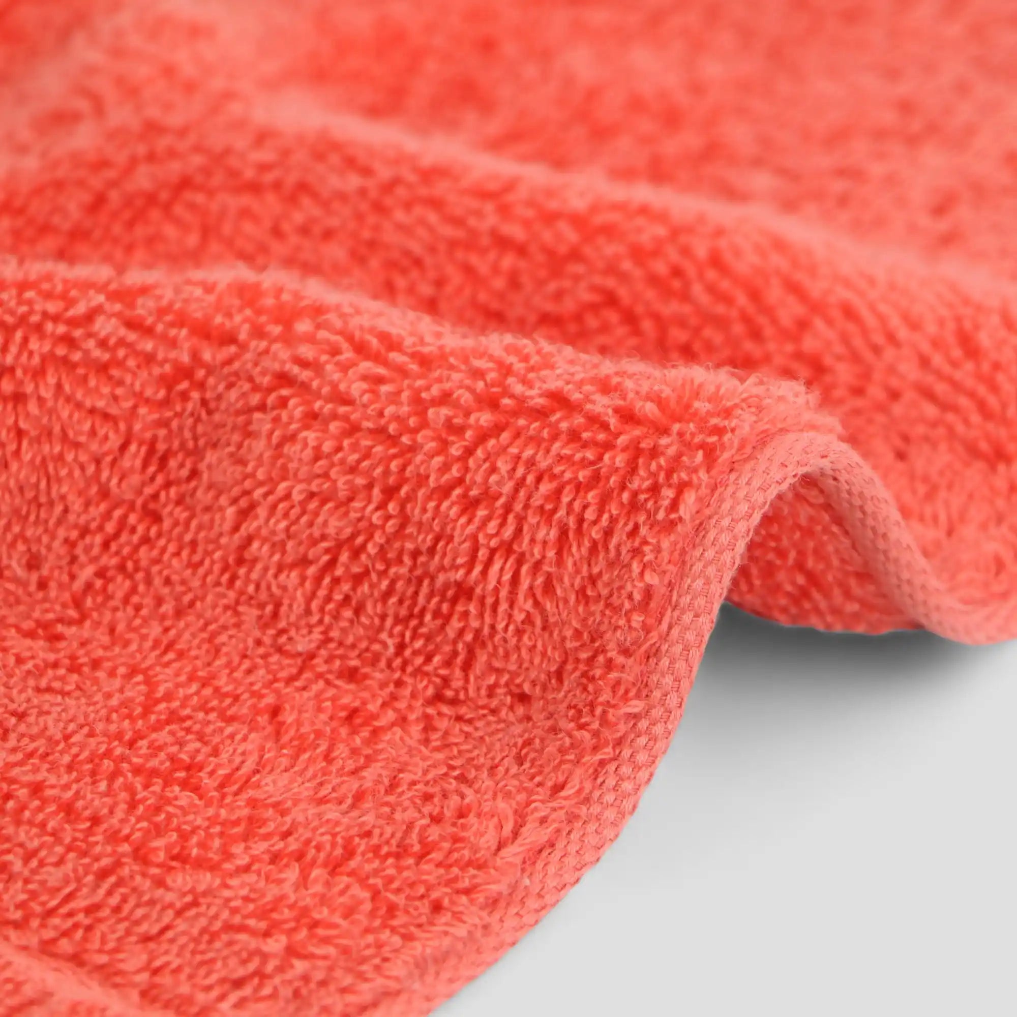 Close-up of a red imabari towel on a light gray background
