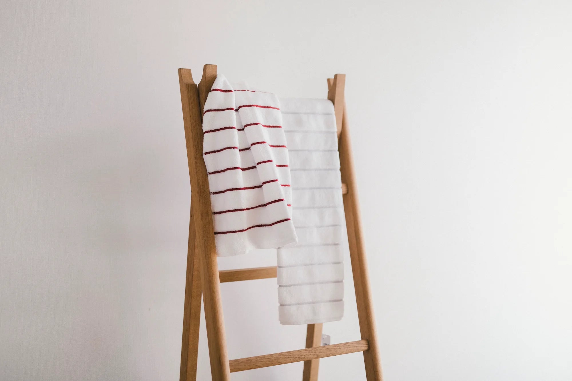 Hanging on the white Imabari towels with red and gray stripe