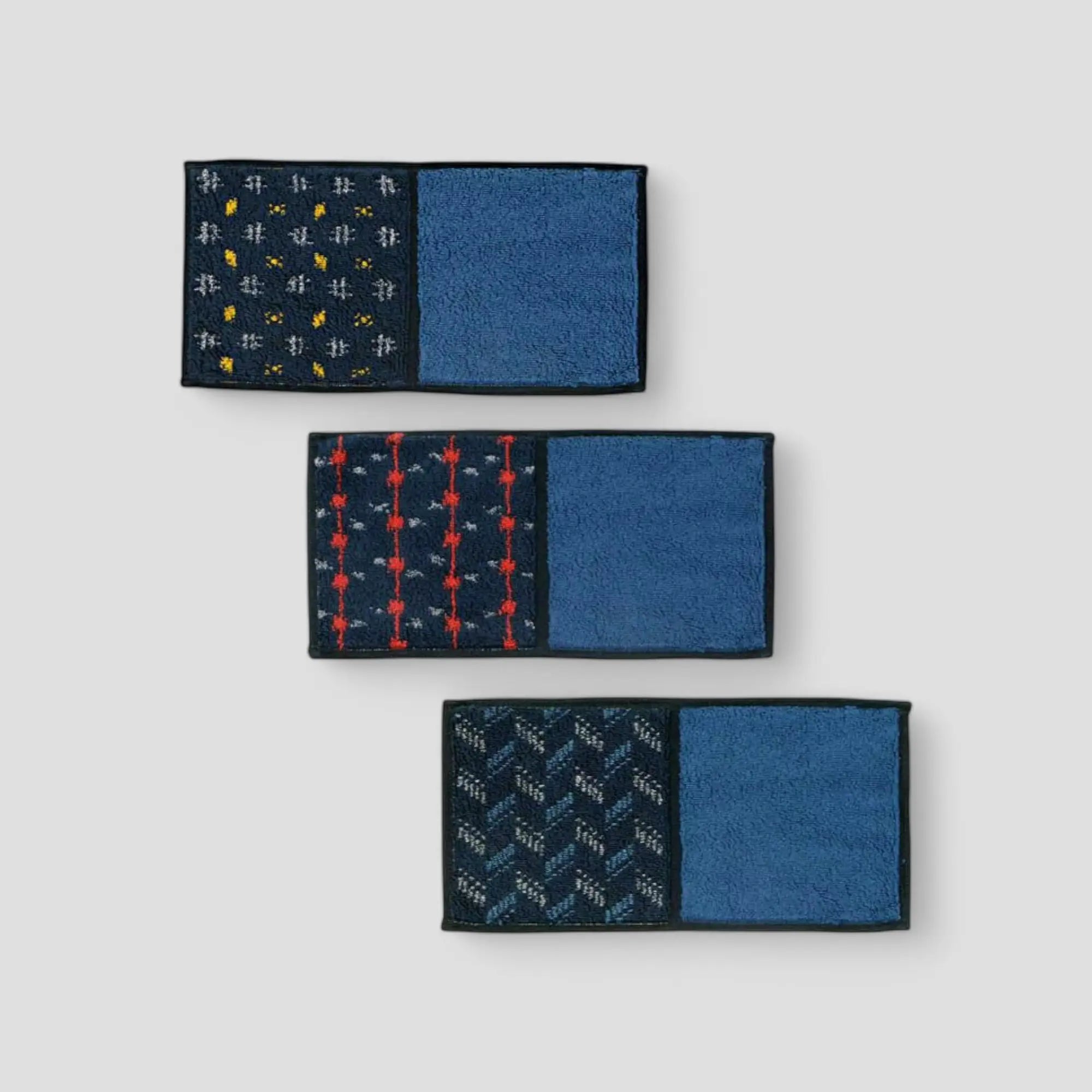 Three Imabari towels in blue with different patterns, displayed against a white background.
