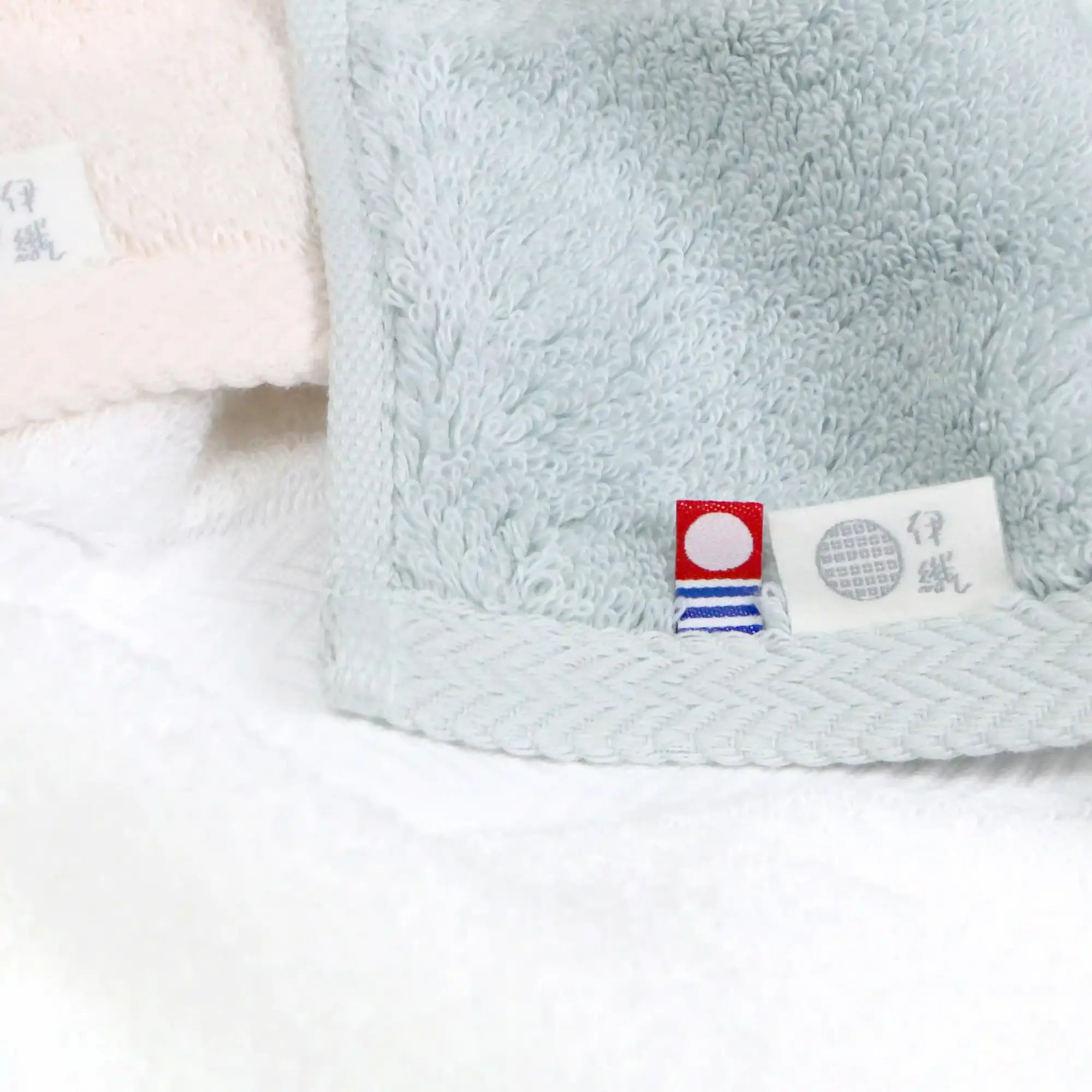 Close-up of the Imabari Towel Japan and Iori tags of Iori's premium Imabari Towel collection.