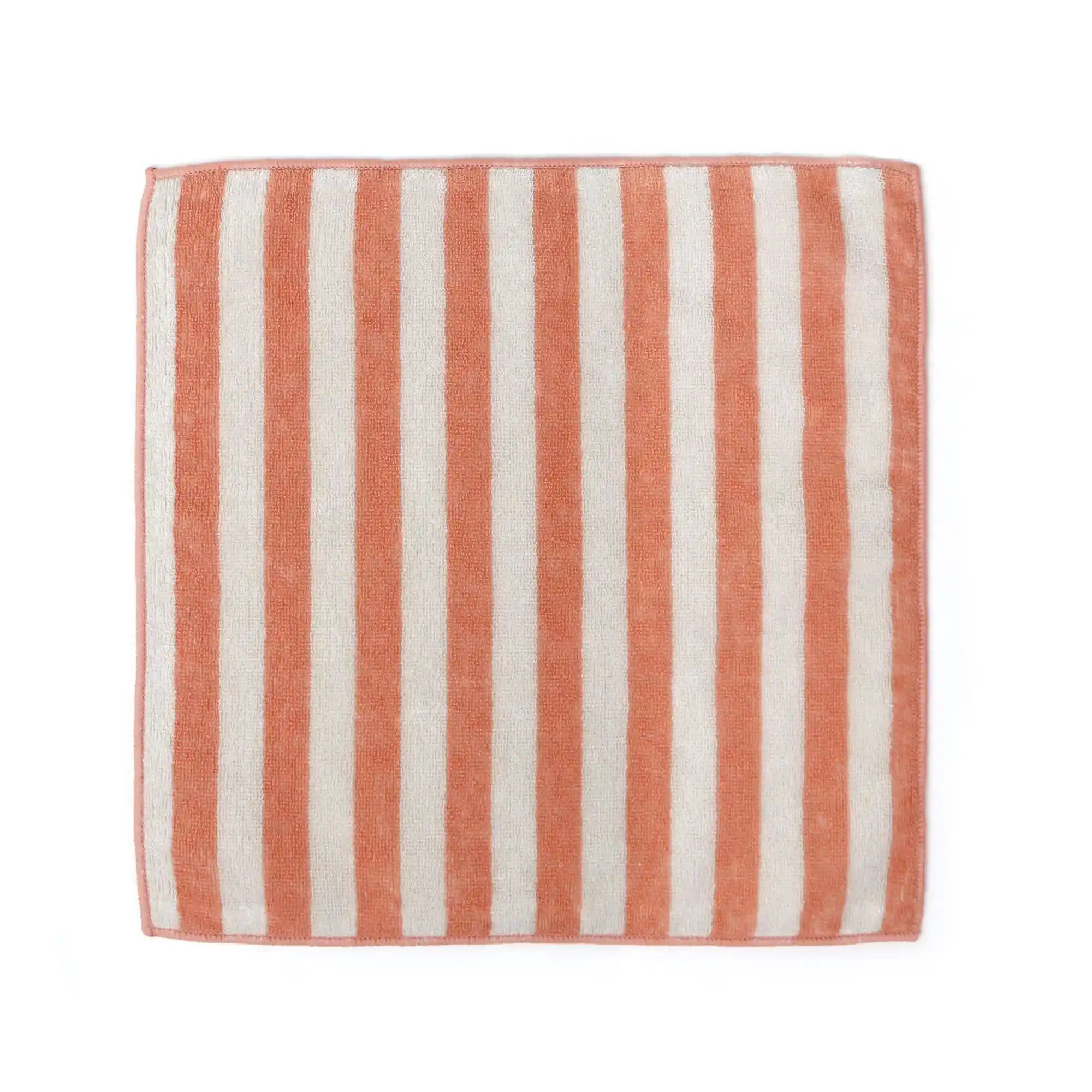 Striped Imabari towel with pink and white vertical stripes on a white background