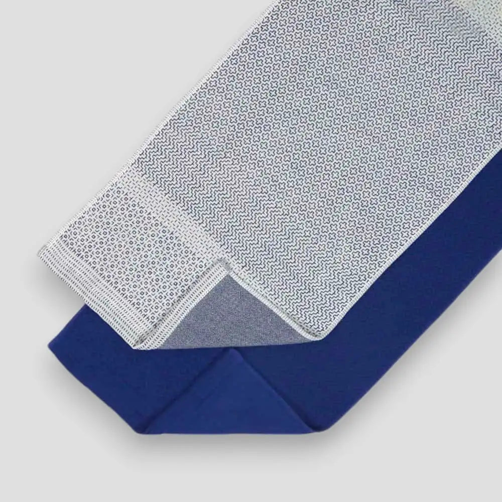 White and blue Imabari towel with a geometric pattern.