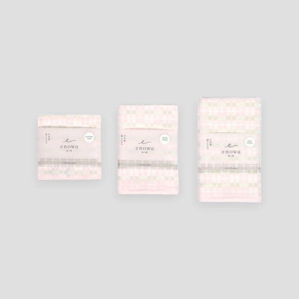 Three folded ENOWA Imabari towels displayed against a white background, with the brand&