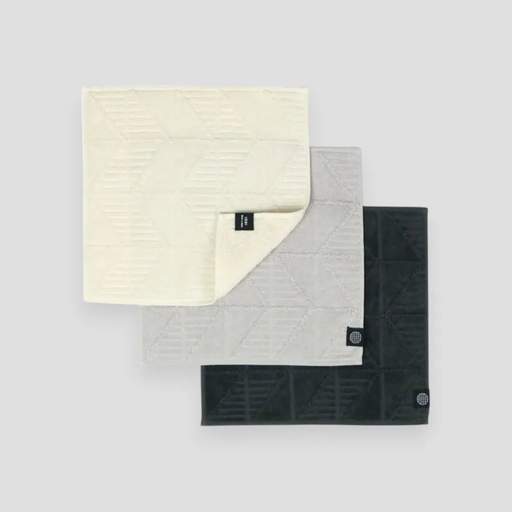 Set of three color Imabari towels on a light gray background