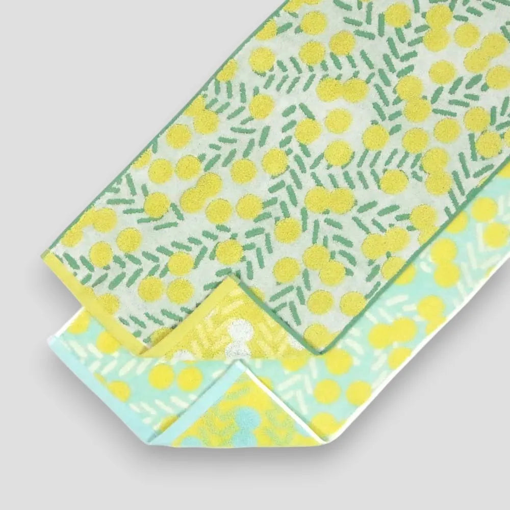 Two white and blue Imabari towels with yellow floral