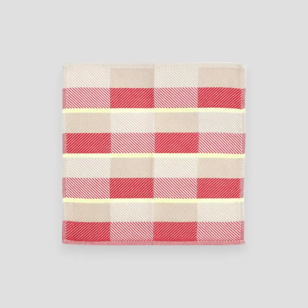 Small Imabari towels in red, beige and yellow displayed