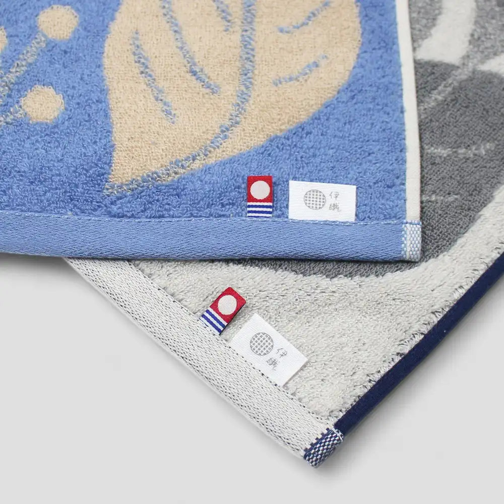 Two Imabari towels with labels of Imabari towel brand mark and IORI&