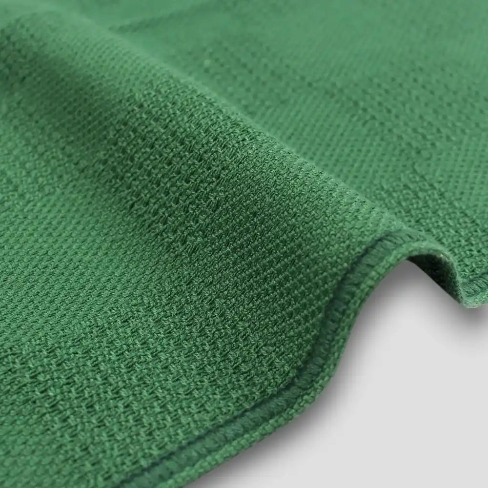 Close-up of a side of "Non-Pile" green Imabari towels 