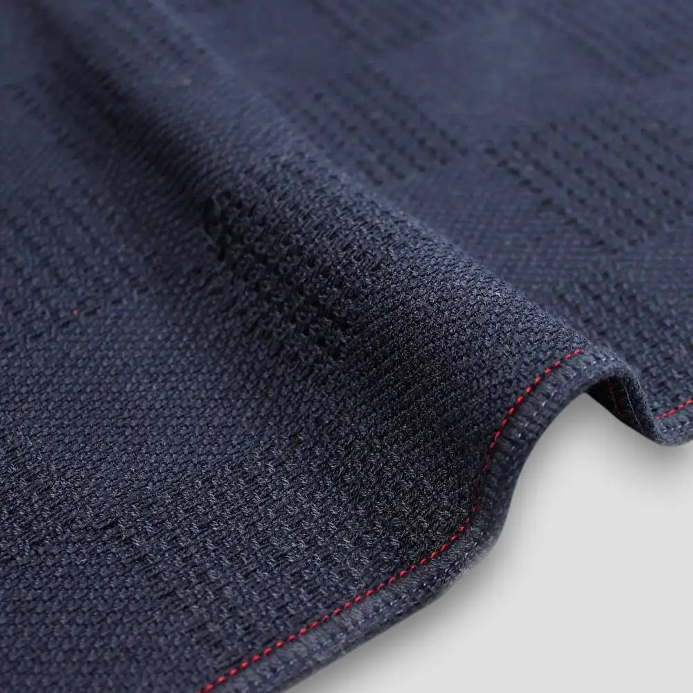 Close-up of a side of "Non-Pile" navy Imabari towels 