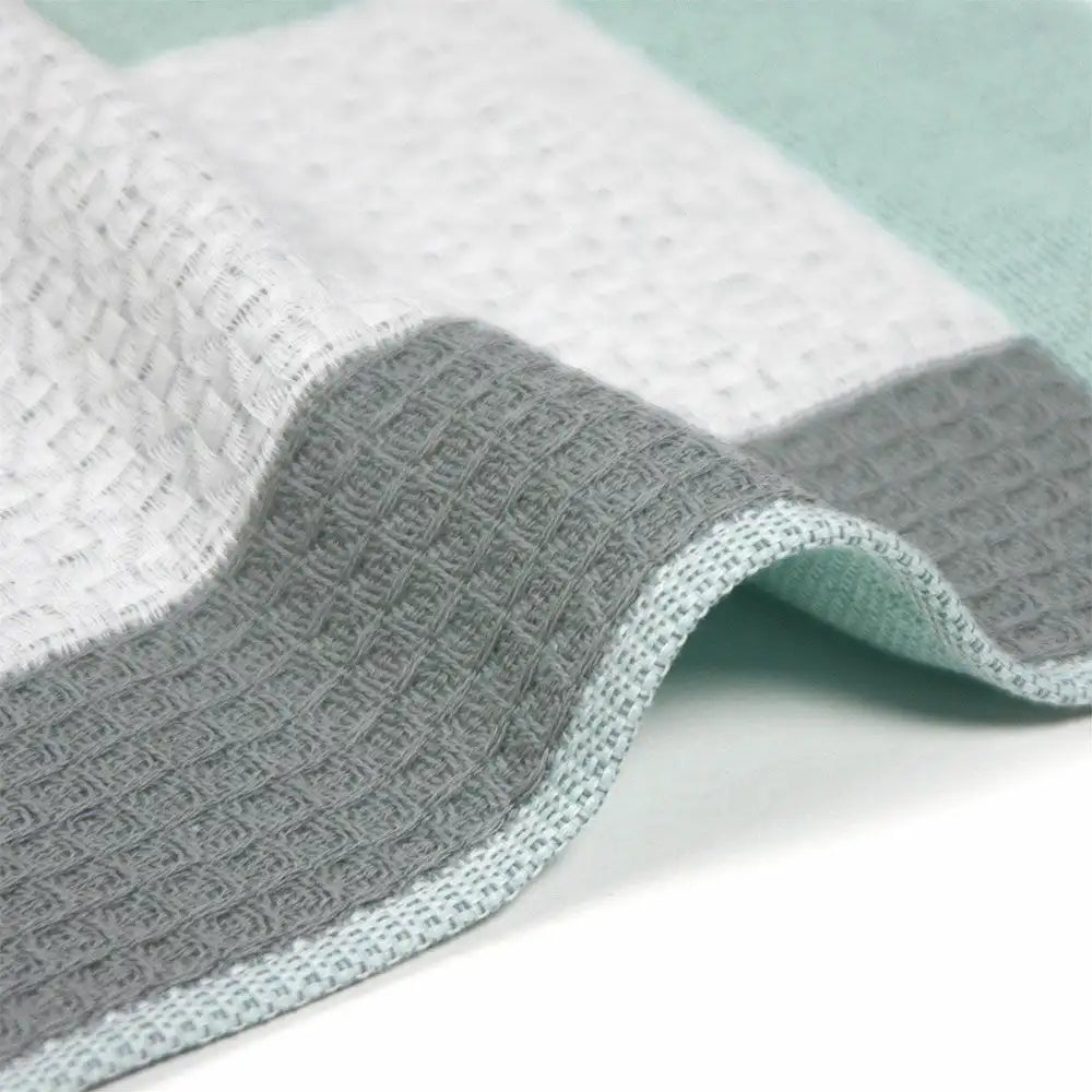 Close-up of a side of patchwork design Imabari towel in gray and white colors 