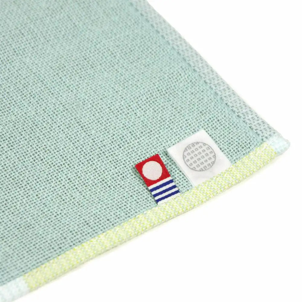 Close-up of labels of Imabari towel brand mark and Iori&