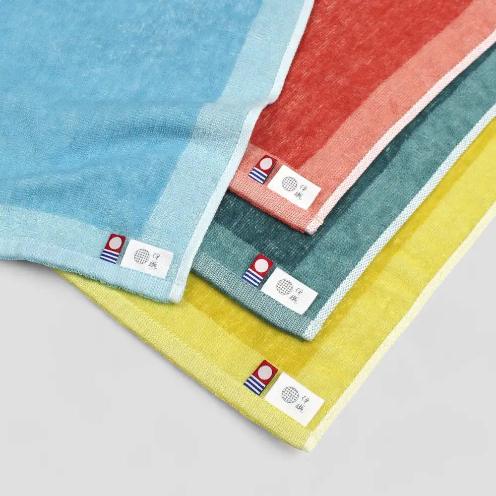 Close-up of 4colors Imabari towel with brand labels