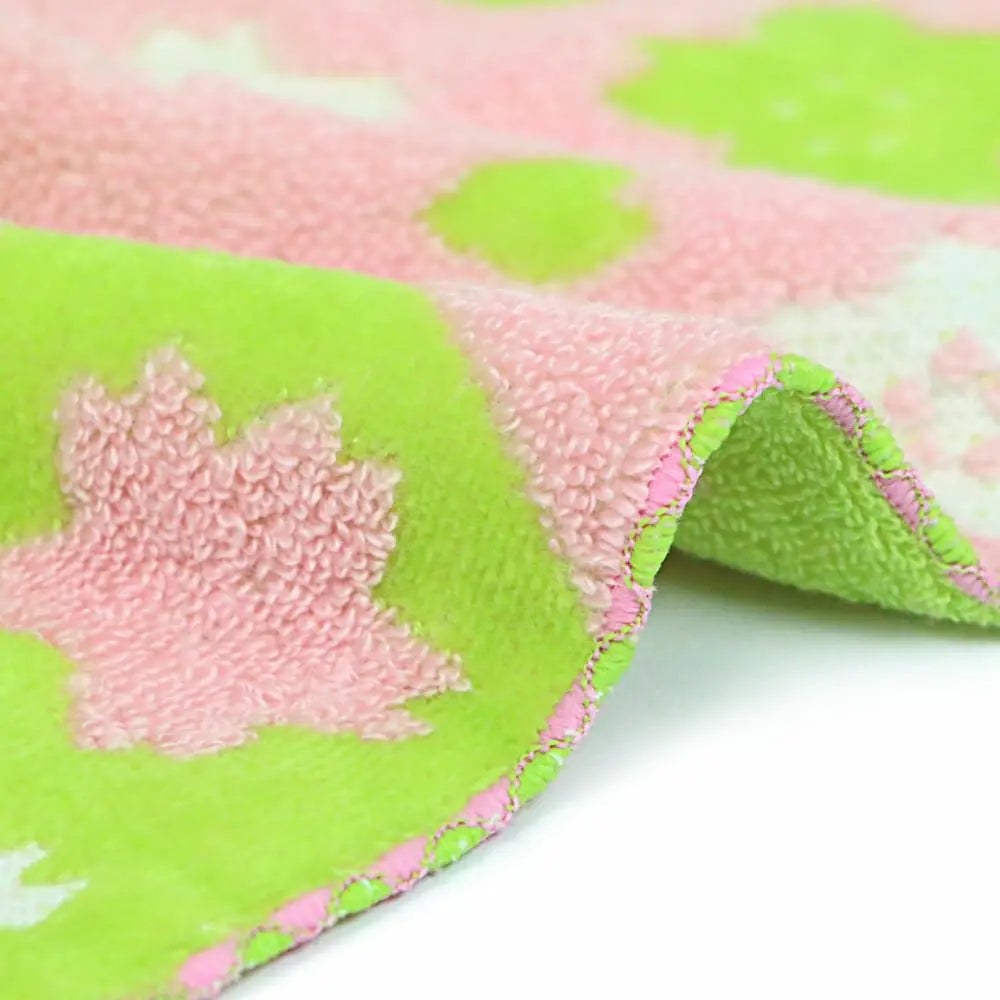 Close-up of a side of square pink and green Imabari towel
