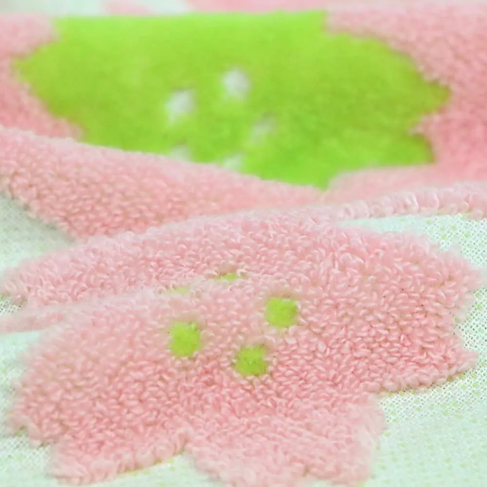 Close-up of pink an green floral pattern Imabari towel