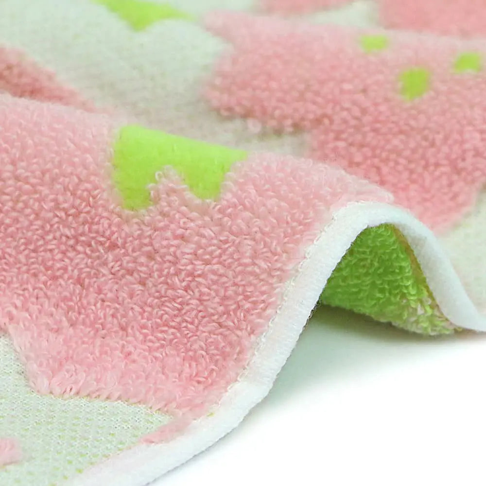 Close up of a side pink and green pattern Imabari towel