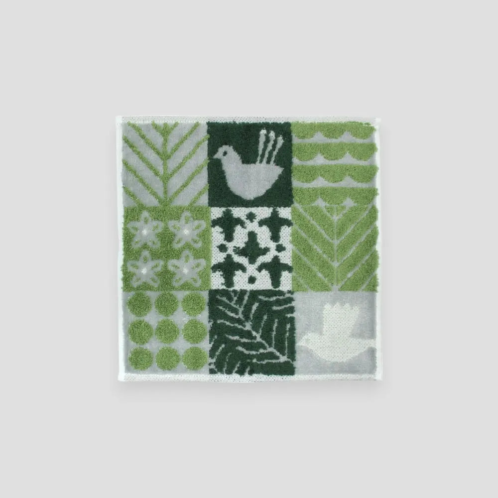 A green bird patterned square Imabari towel