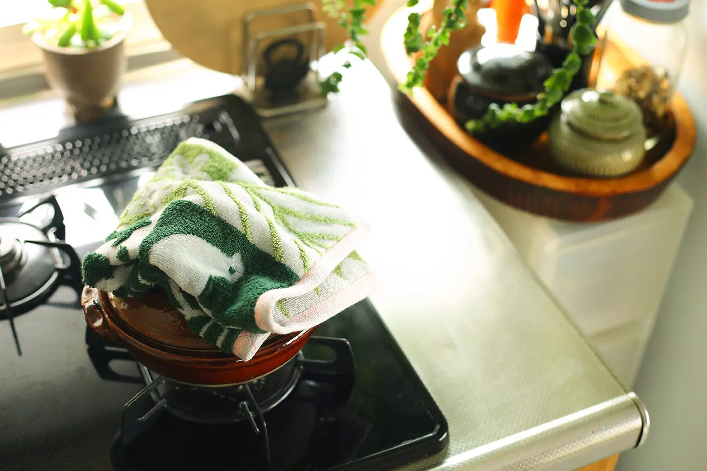 Green bird pattern Imabari towel leave on the pot in the kitchen
