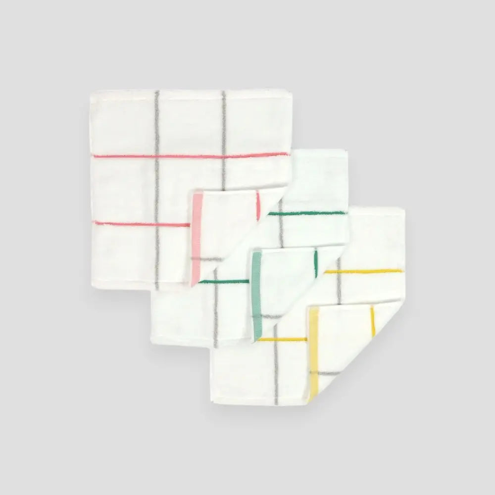 Square white Imabari towels with color stripe on gray background