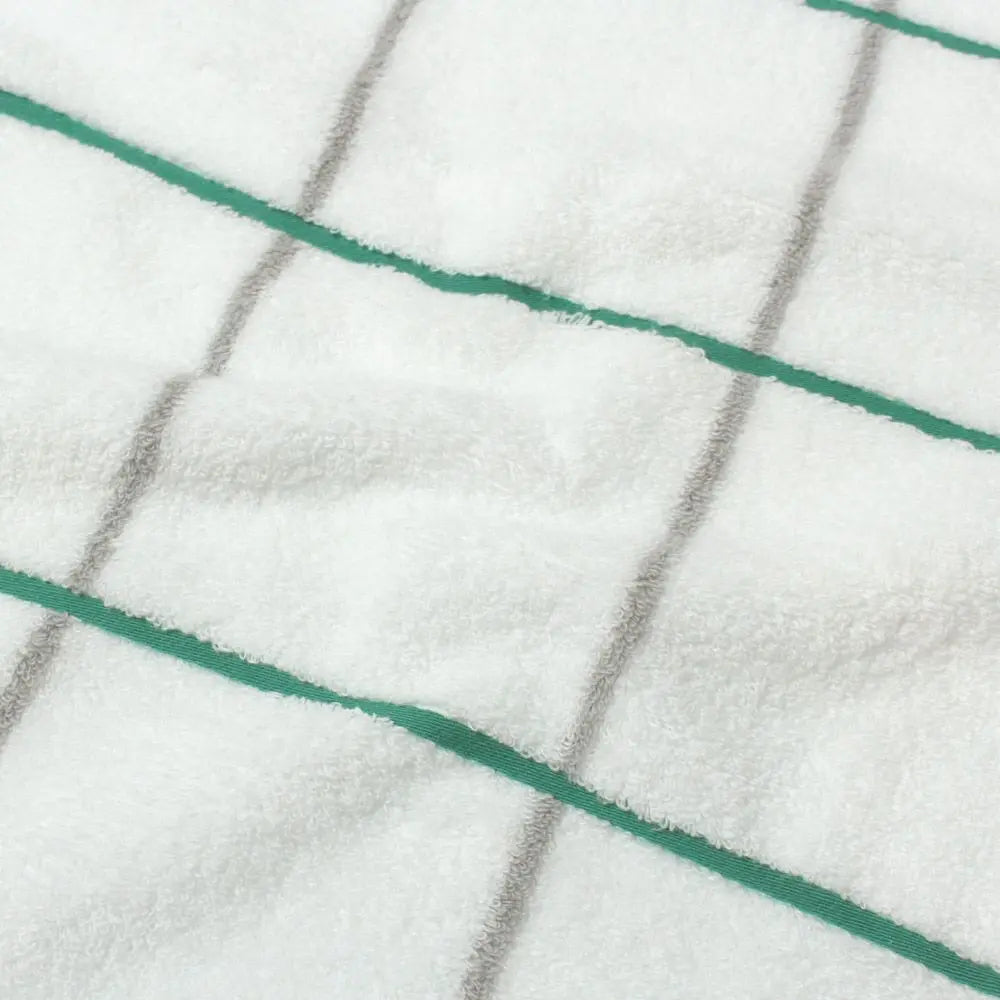 Close-up of  cotton fabric of white Imabari towel with green and gray line