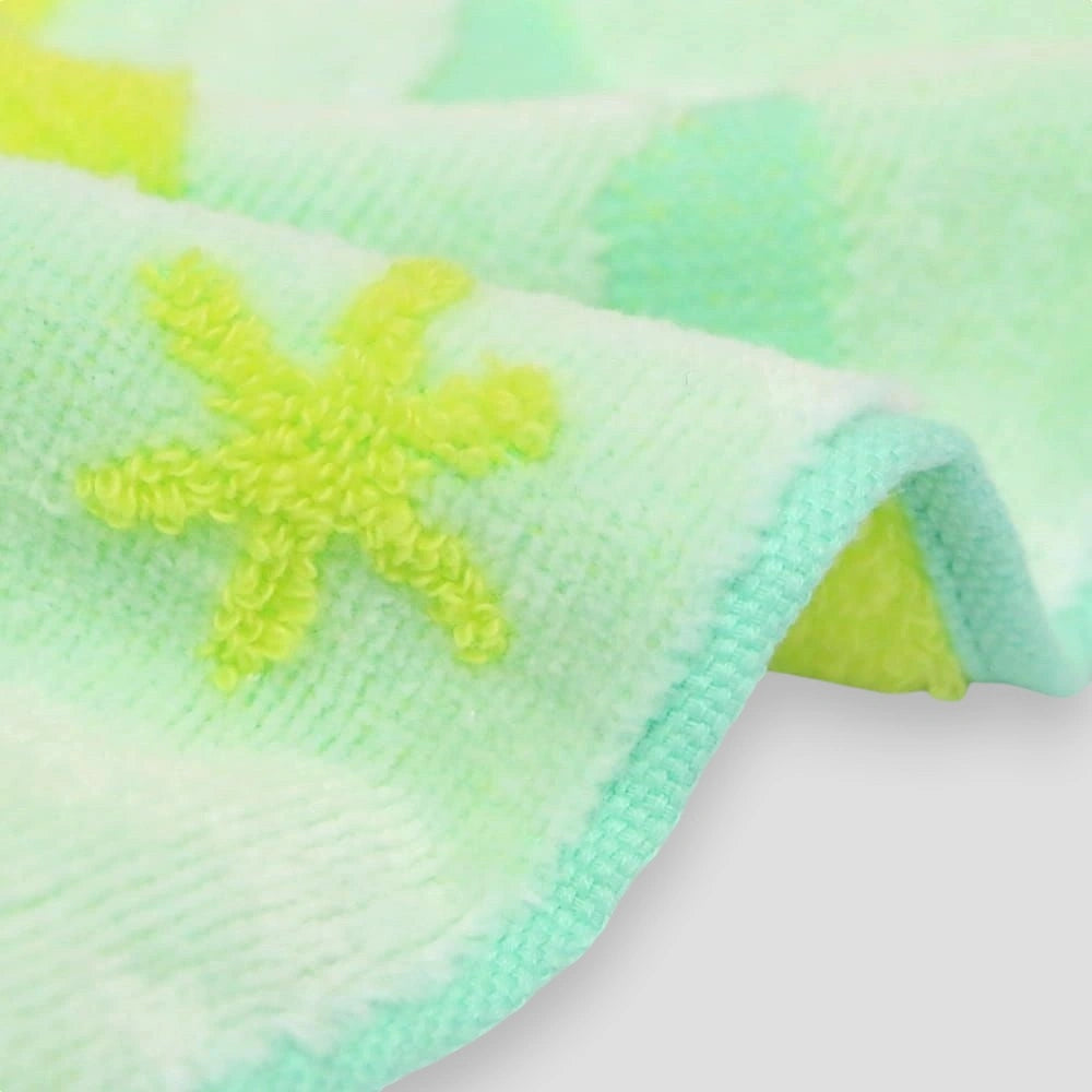Close up of side of a yellow floral Imabari towel 