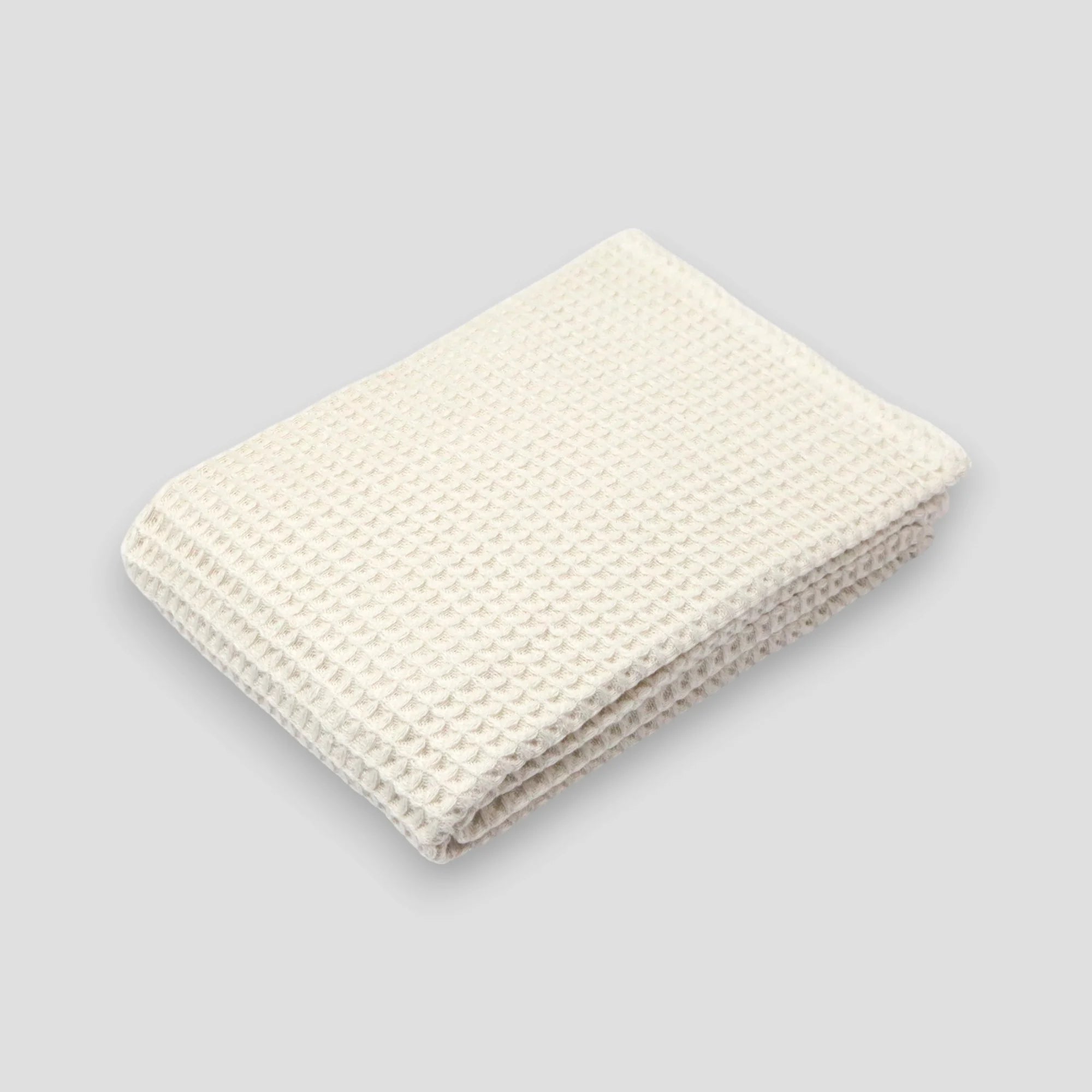 Off-white waffle Imabari towel on a gray background