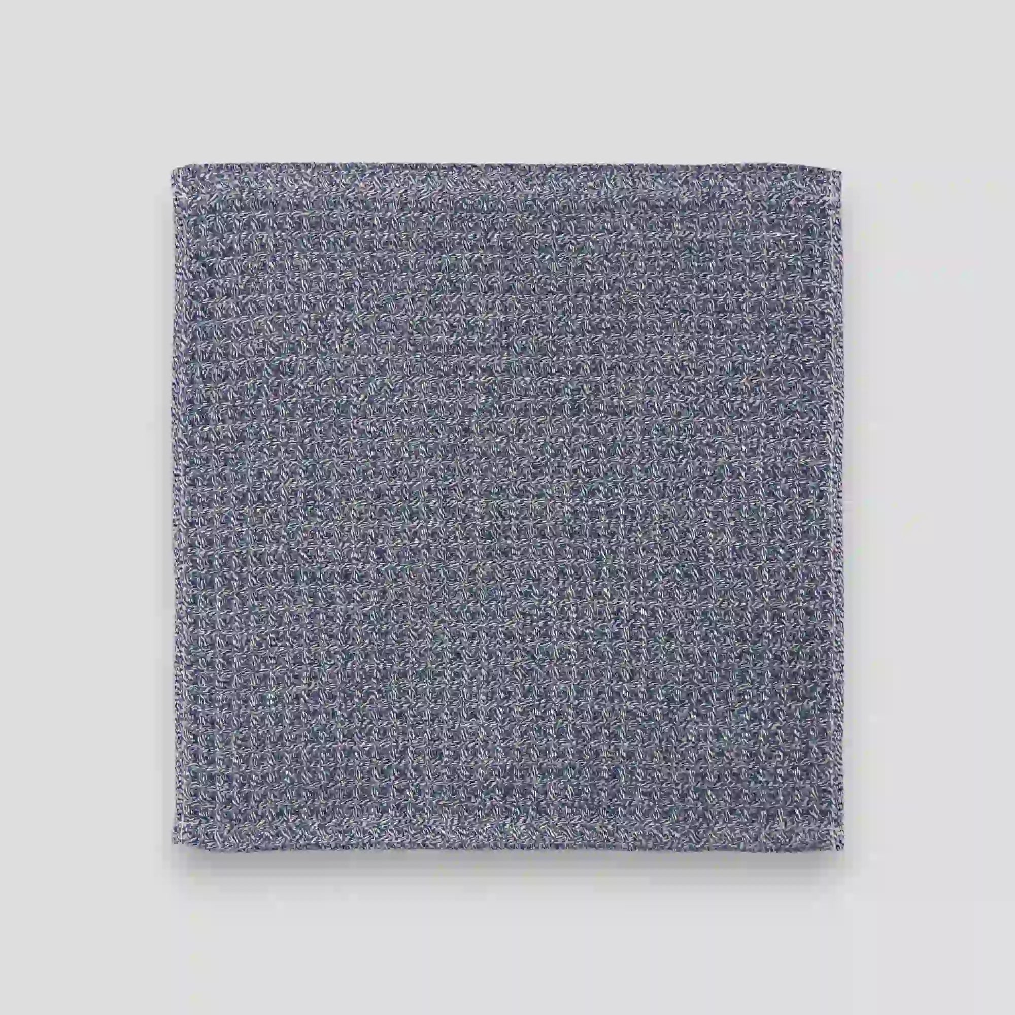 Navy waffle Imabari towel on a gray background