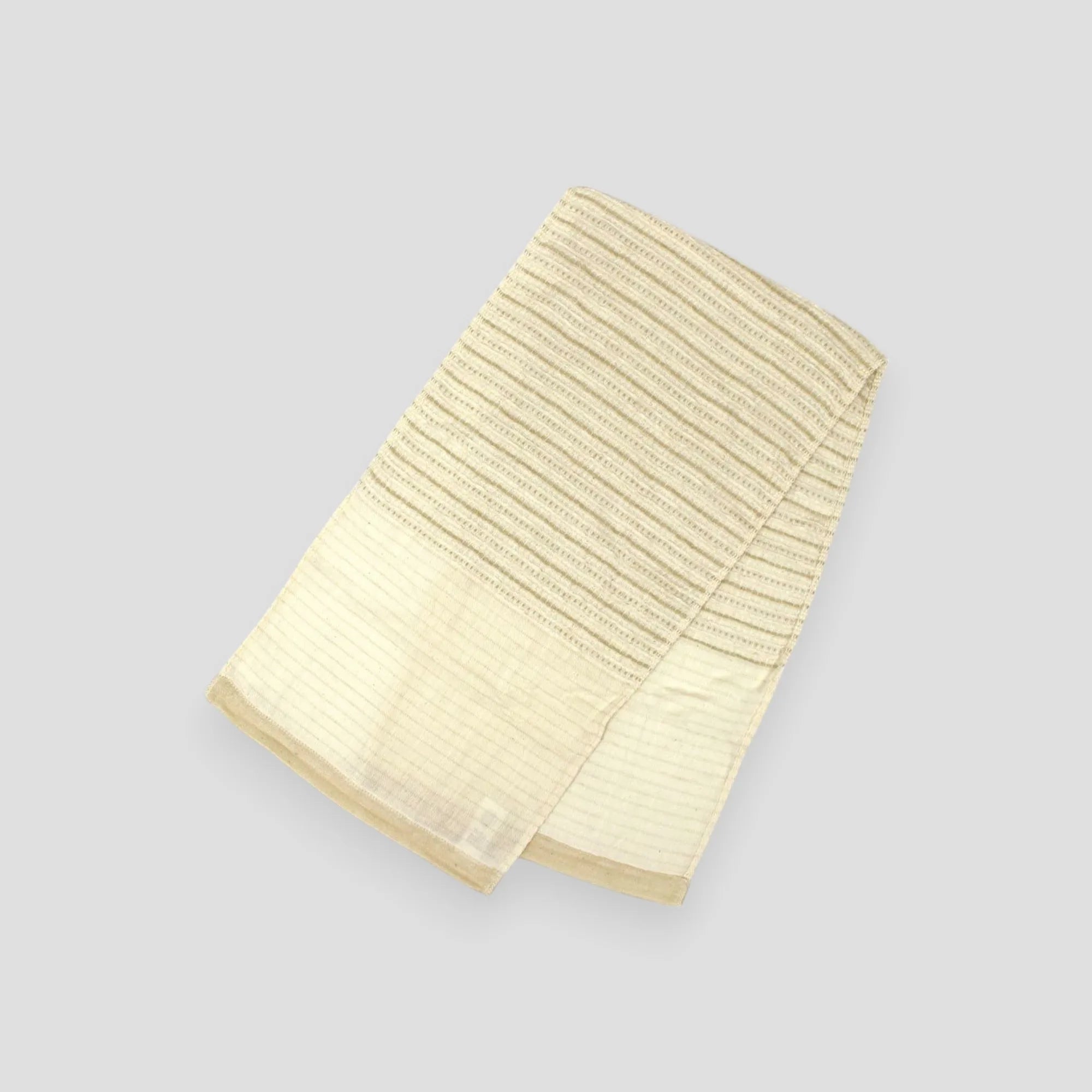 Folded in half of Oganic cotton Imabari towel laid flat.