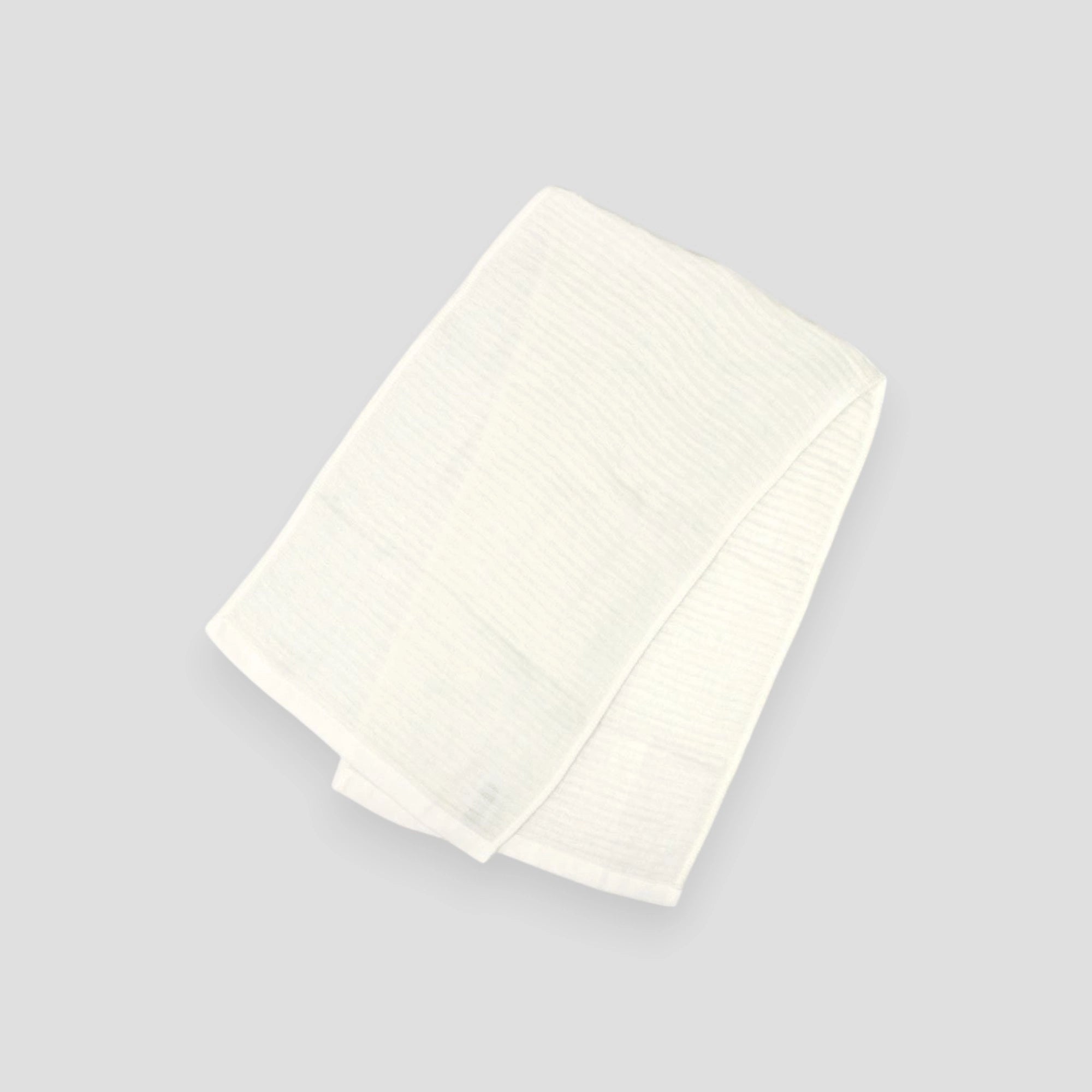 Folded in half of soft foam Imabari towel laid flat.