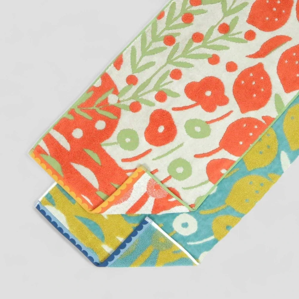 A set of Imabari towels with multicolored patterns, including orange and blue tones, made from 100% cotton.