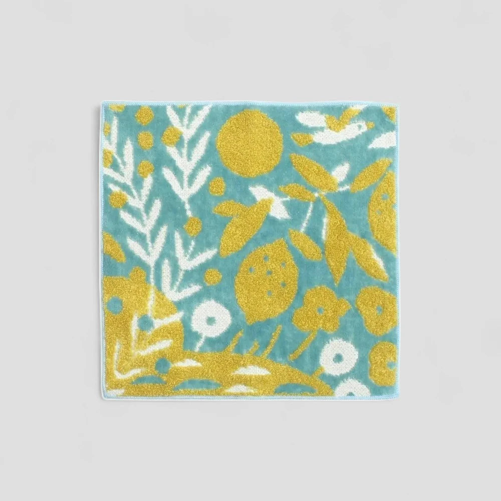 Small Imabari towel with multicolored patterns, including blur and yellow  tones, made from 100% cotton.