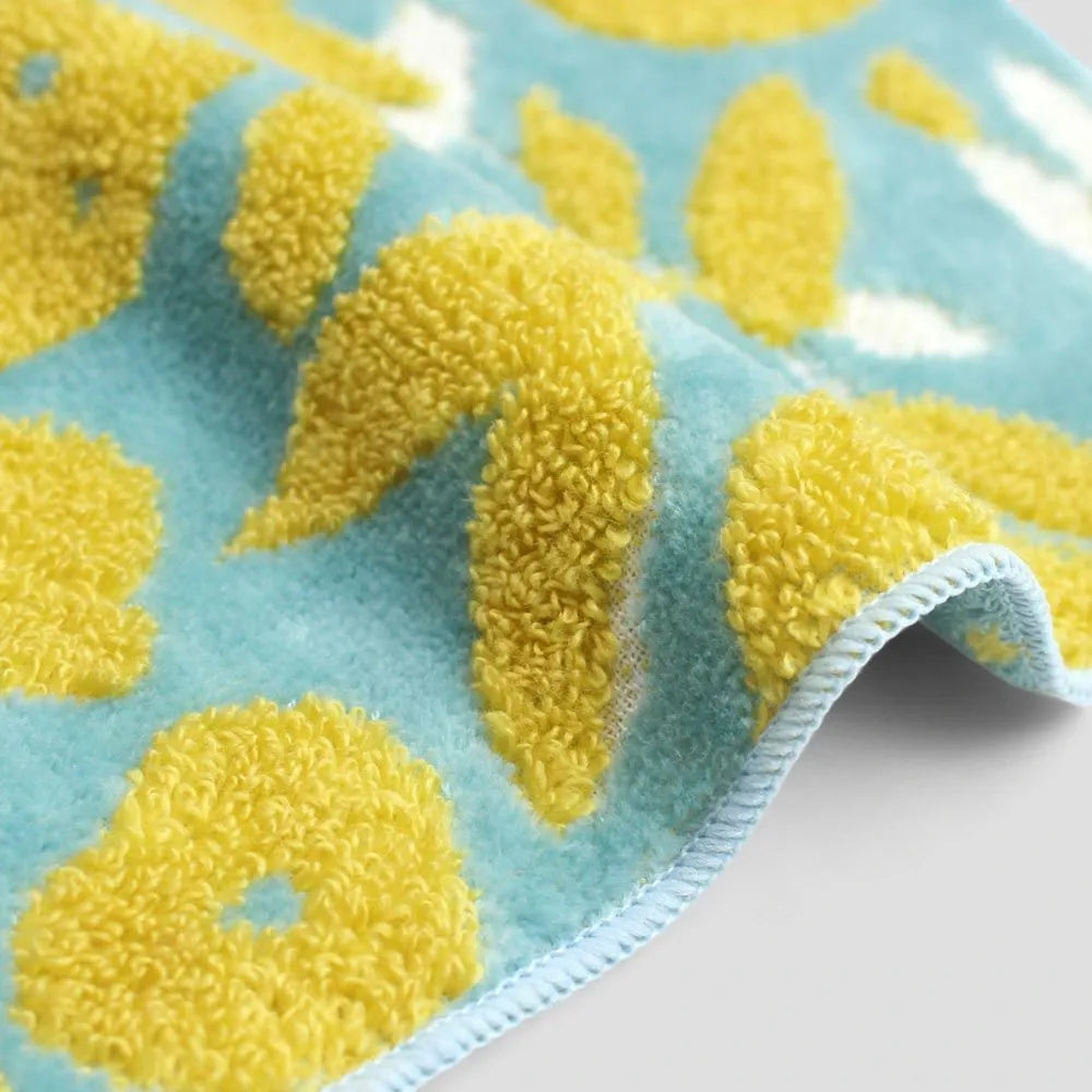 Close-up of a side blue Imabari towel with yellow pattern
