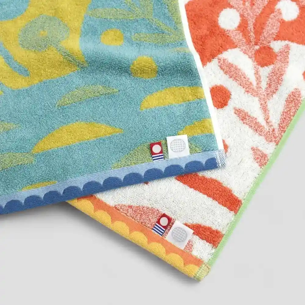 Close-up of Imabari towels with labels of Imabari towel brand mark and IORI&