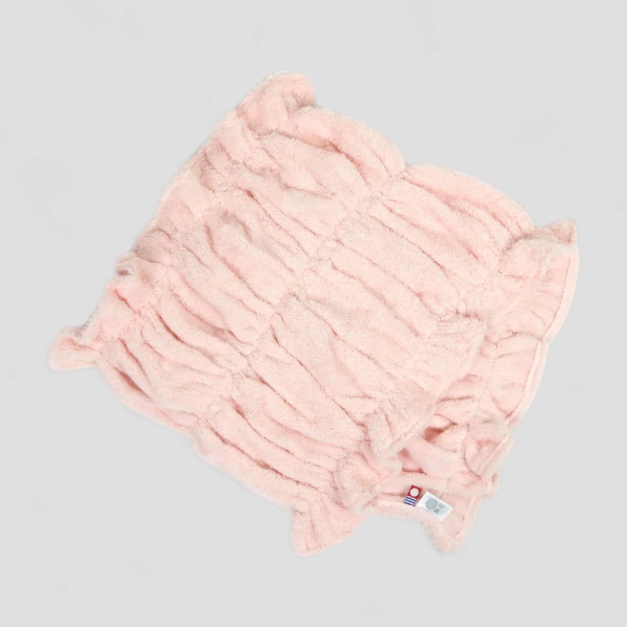 Pink Imabari towel hair-dry-towel on a light gray background