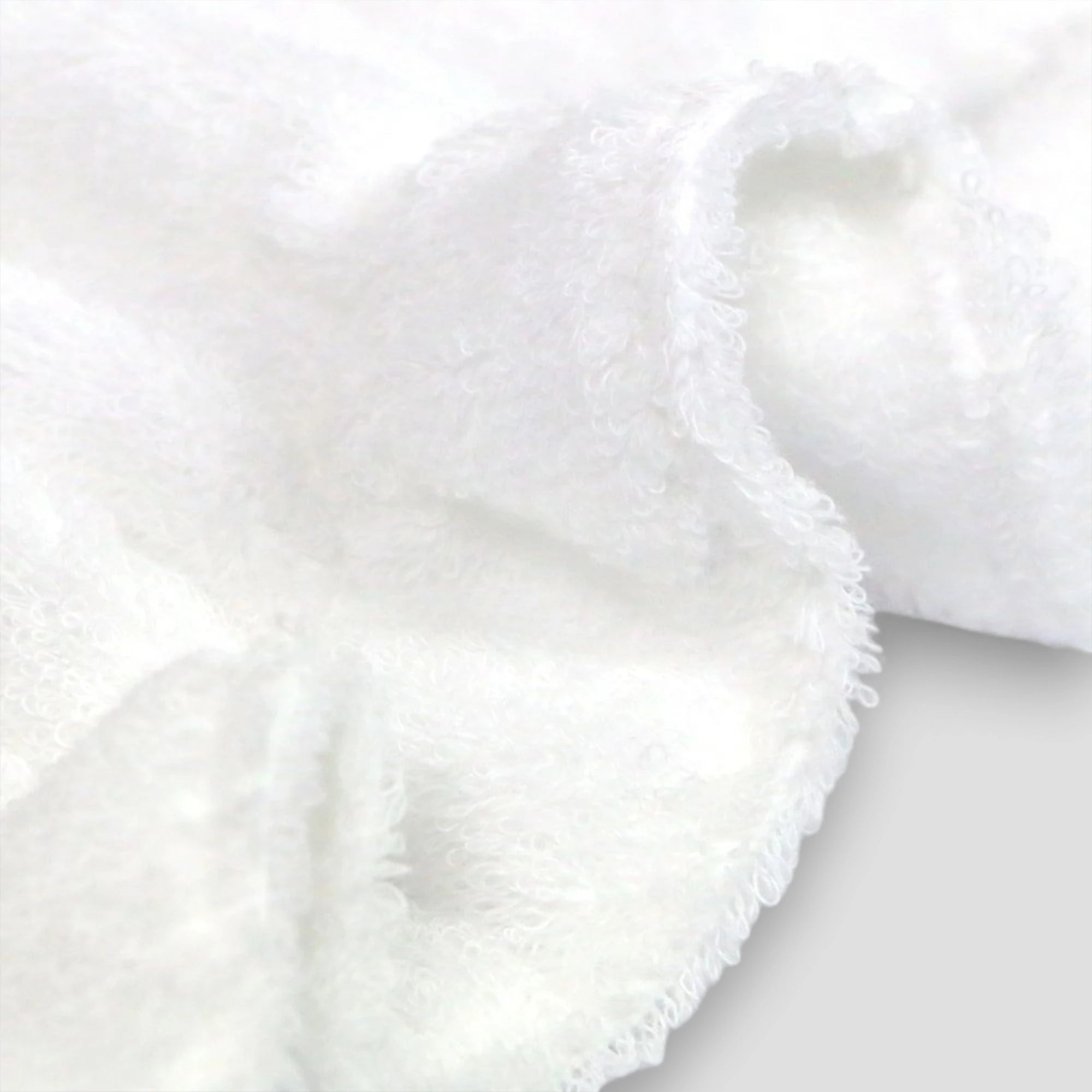 Close-up of Imabari towel white fluffy fabric on a light gray background