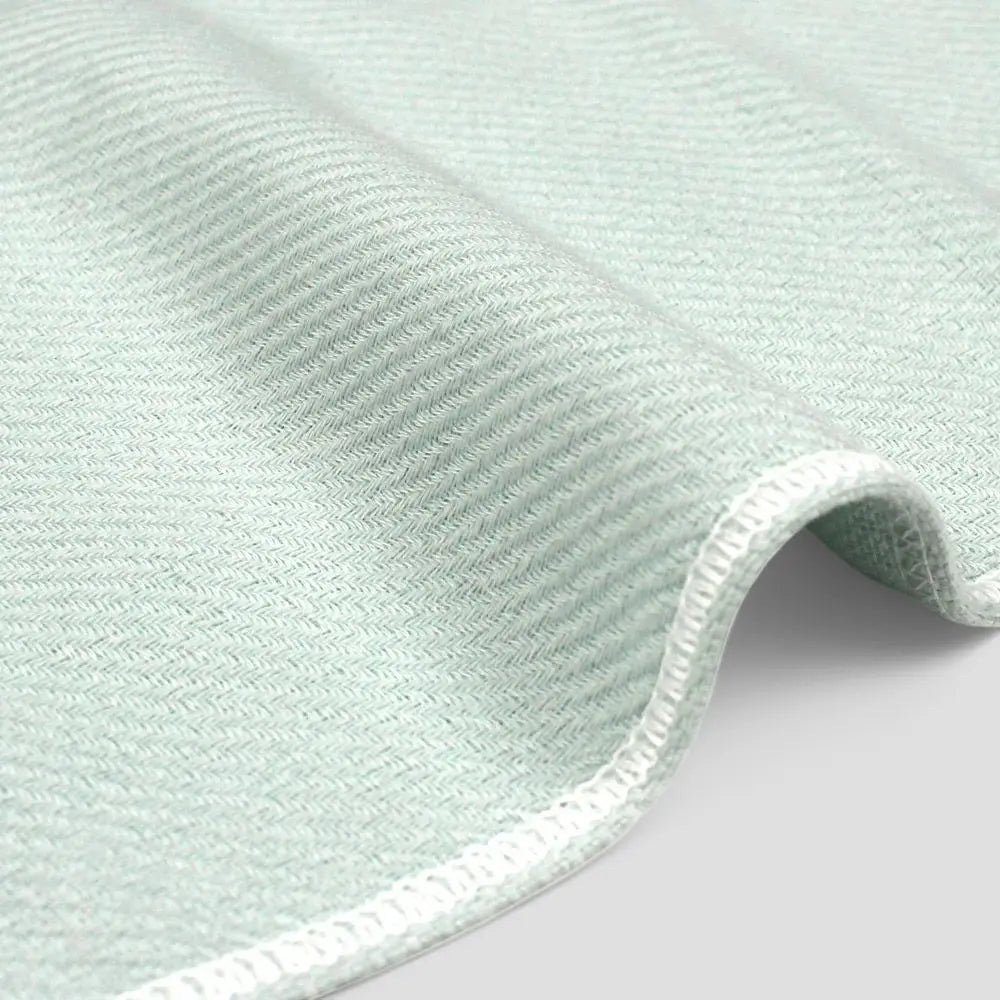 Close-up of a side of blue Imabari towel made from cotton gauze.