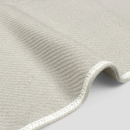 Close-up of a side of gray Imabari towel made from cotton gauze.