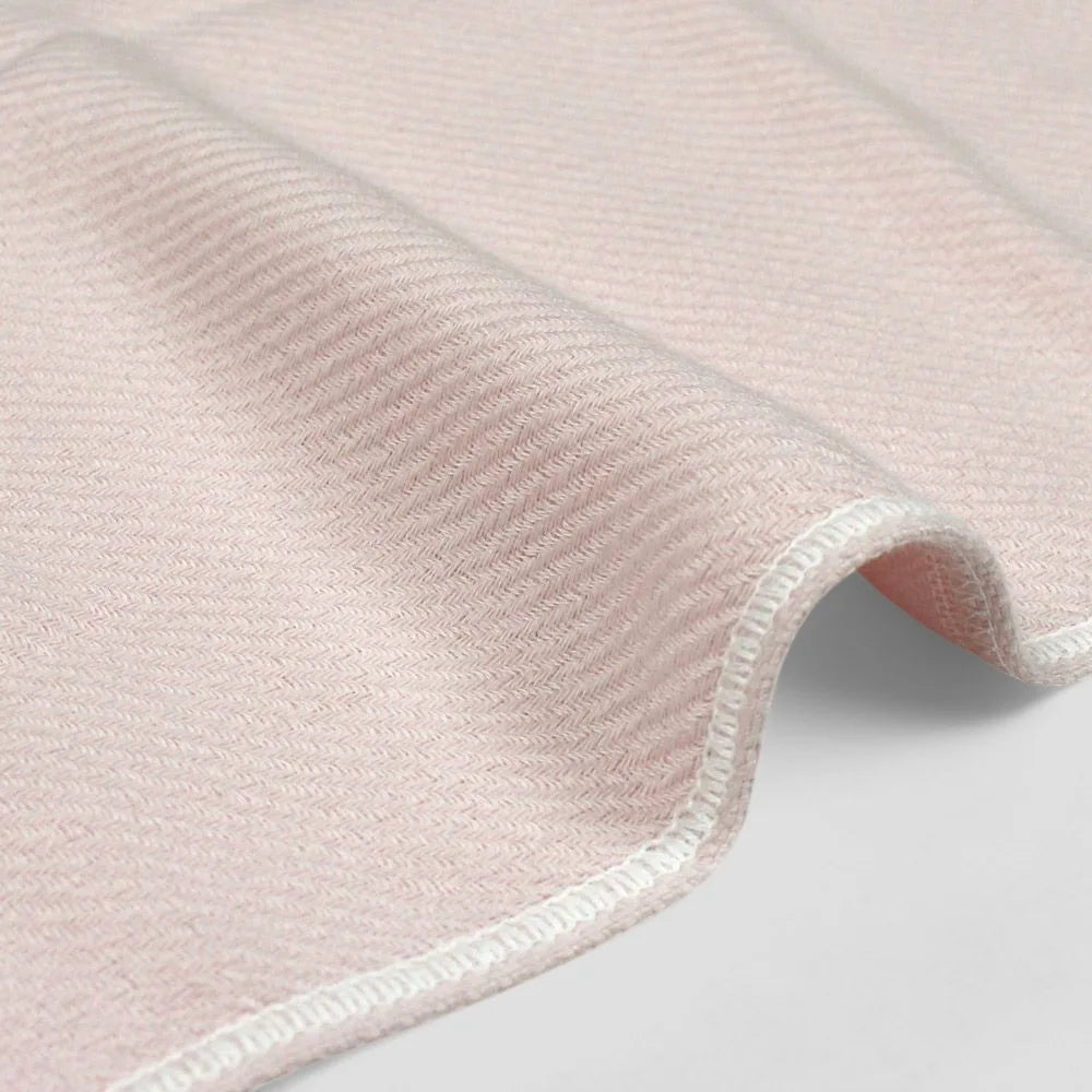 Close-up of a side of pink Imabari towel made from cotton gauze.