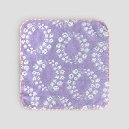 Floral-patterned  Imabari towel  on a light gray background