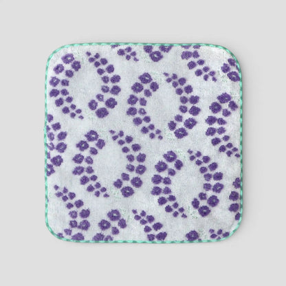 Imabari towel square with purple floral pattern on a light gray background
