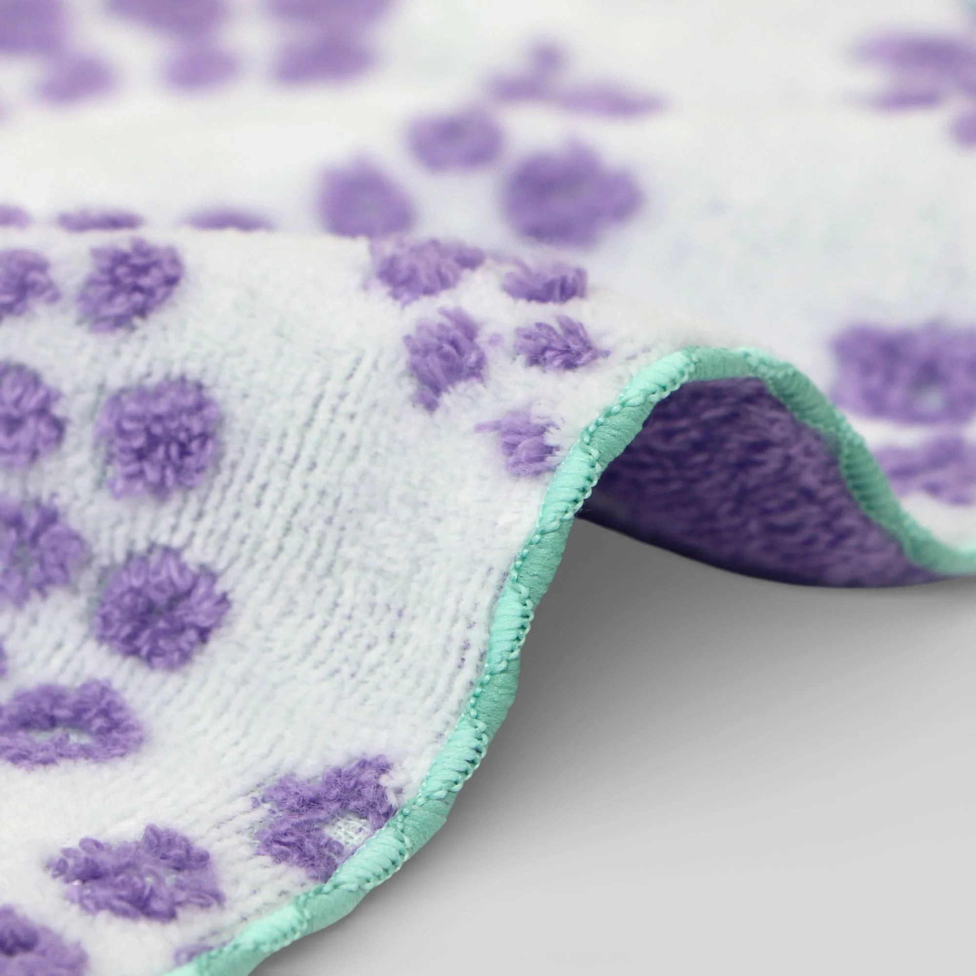 Imabari towel with purple and green pattern on a white background