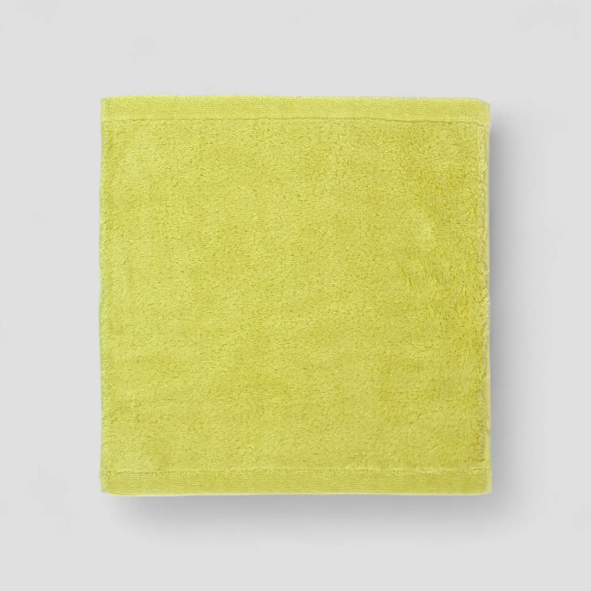 Green  Imabari towel on a light gray background