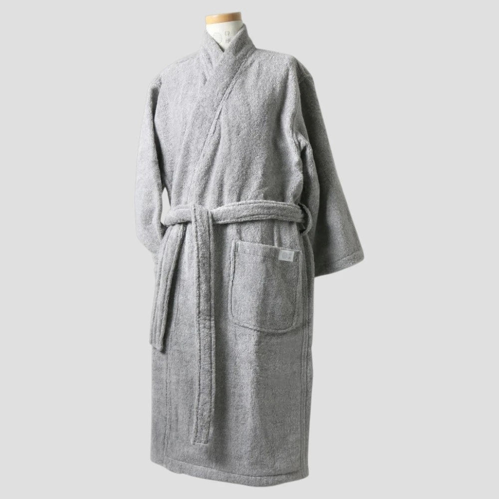A light gray textured terry cloth Imabari towel bathrobe displayed on a mannequin torso against a solid light gray background.