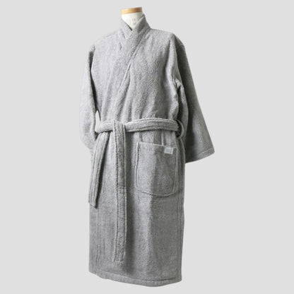 A light gray textured terry cloth Imabari towel bathrobe displayed on a mannequin torso against a solid light gray background.