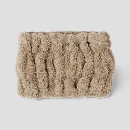 Beige textured Imabari towel head band on a light gray background