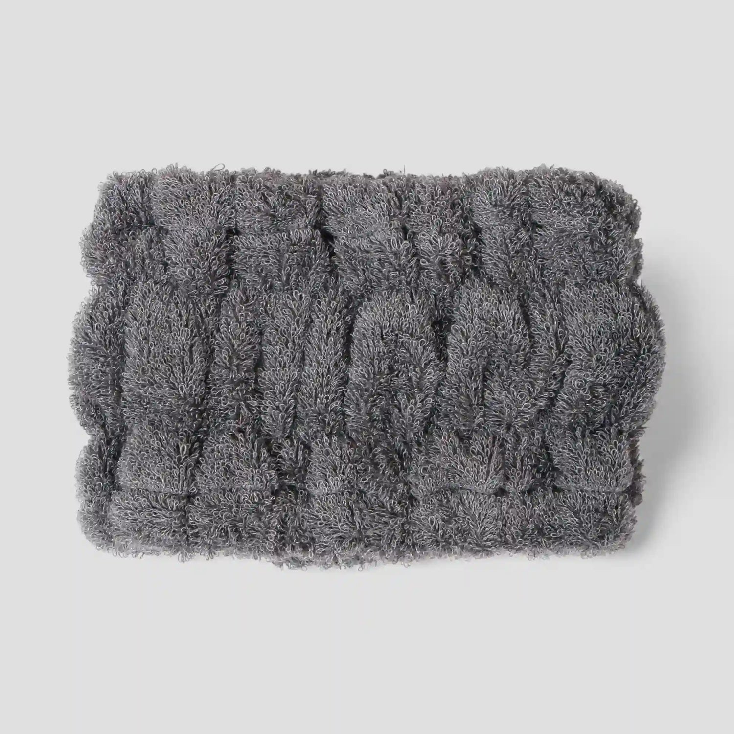 Gray textured Imabari towel head band on a light gray background