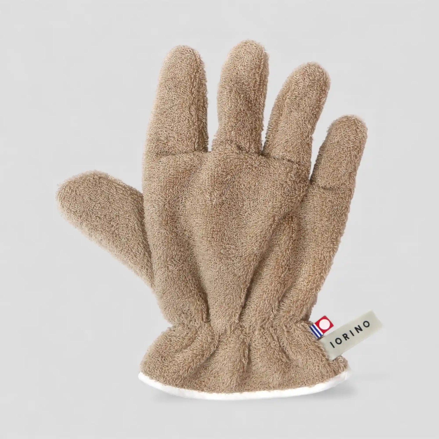 Beige Imabari towel glove with a brand label on a light gray background