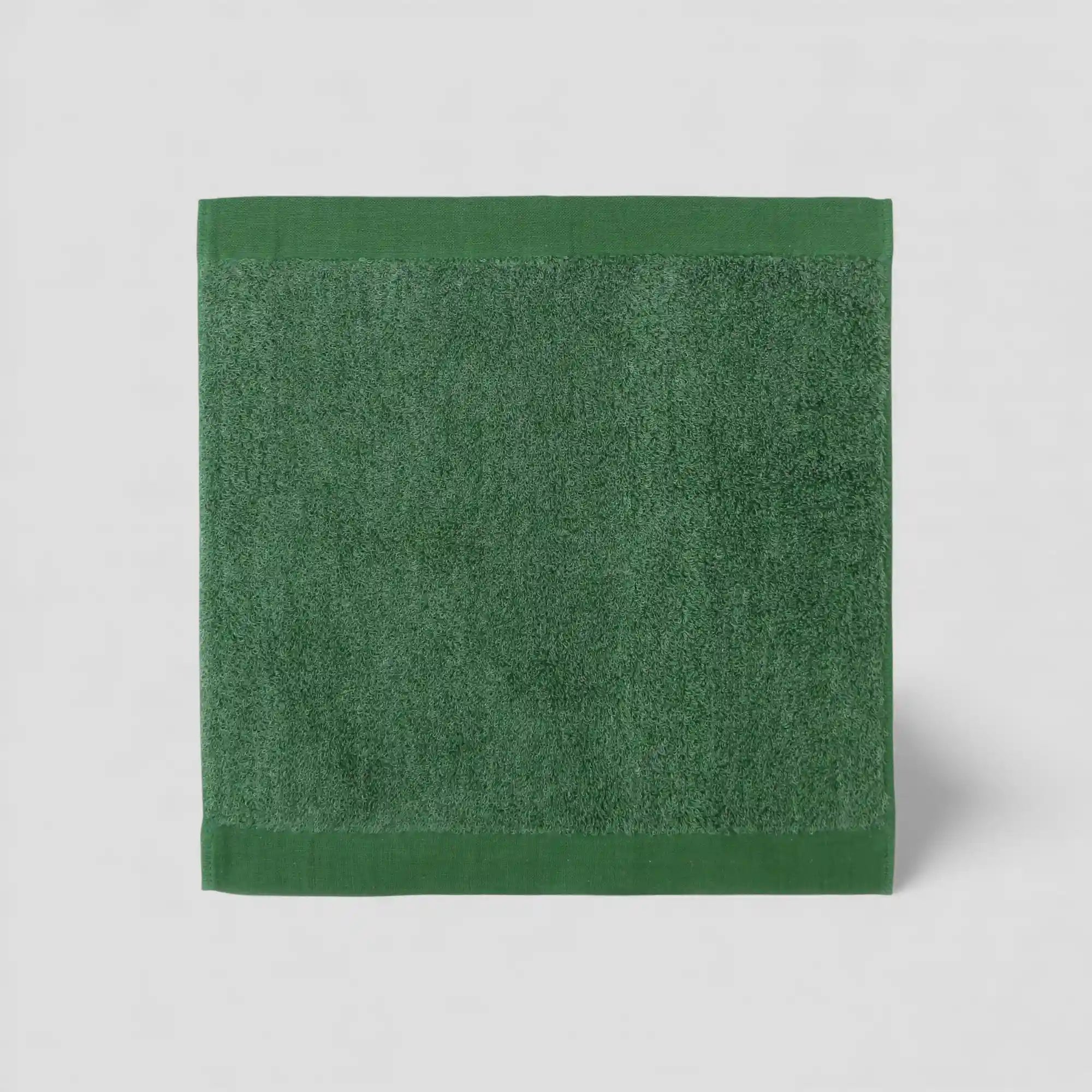 Green Imabari towel on a light gray background