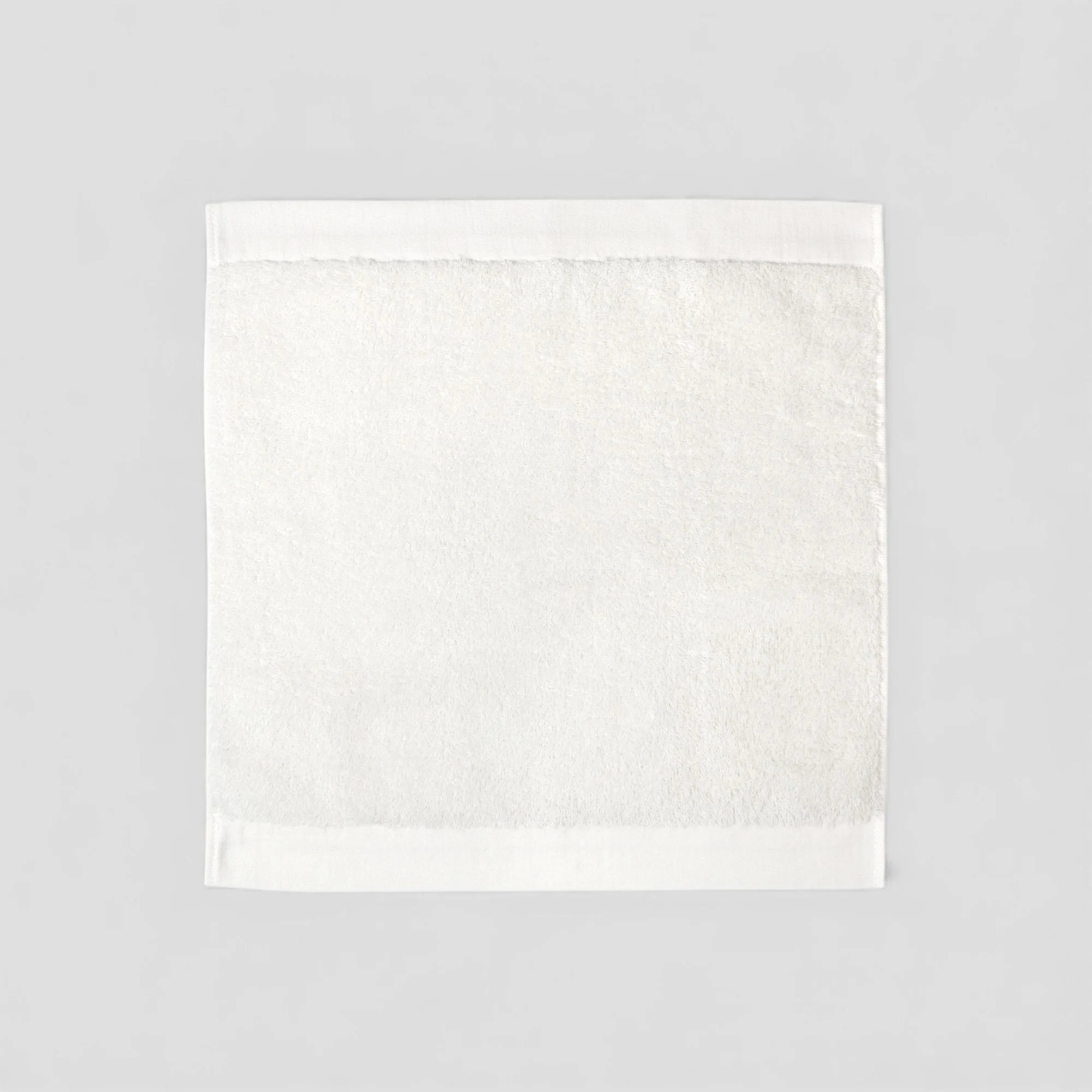 White Imabari towel on a light gray background